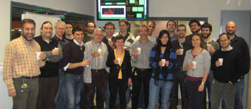 People celebrating booster and storage ring installation